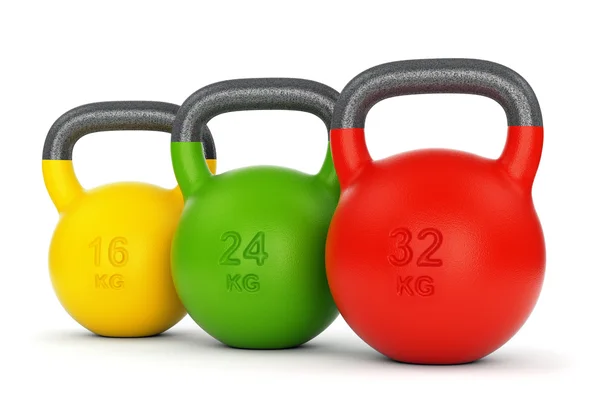 Tre kettlebell colorati — Foto Stock