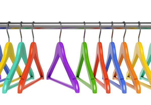 Colorful hangers on cloth rail — Stock Photo, Image