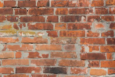 abstract brown, red and prange brick and grey cement wall