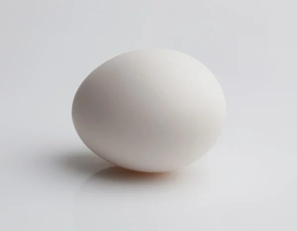 Raw egg on a light background — Stock Photo, Image