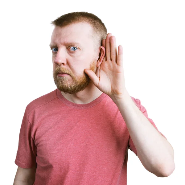 Un hombre con barba está escuchando algo. —  Fotos de Stock