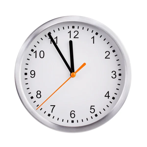 Round clock shows five minutes to twelve — Stock Photo, Image