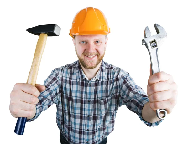 Man in the helmet with a hammer, wrench — Stock Photo, Image