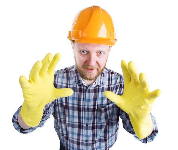 Man in a helmet and yellow gloves — Stock Photo, Image