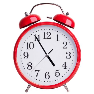 Round alarm clock showing almost five clipart