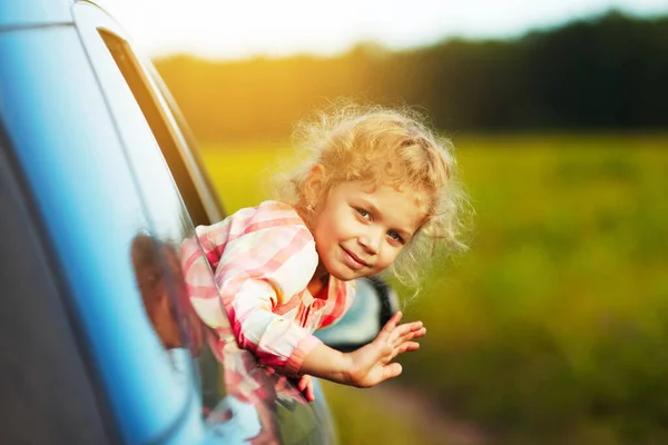 Little Girl Waving Her Hand Car Window — Stock Photo, Image