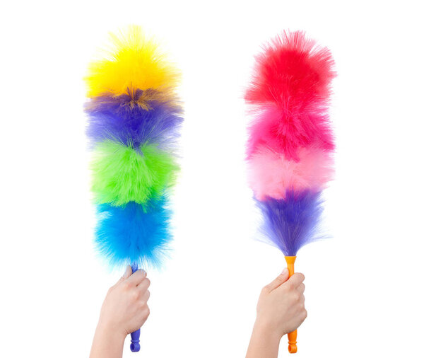 Dust brush in human hand on white background