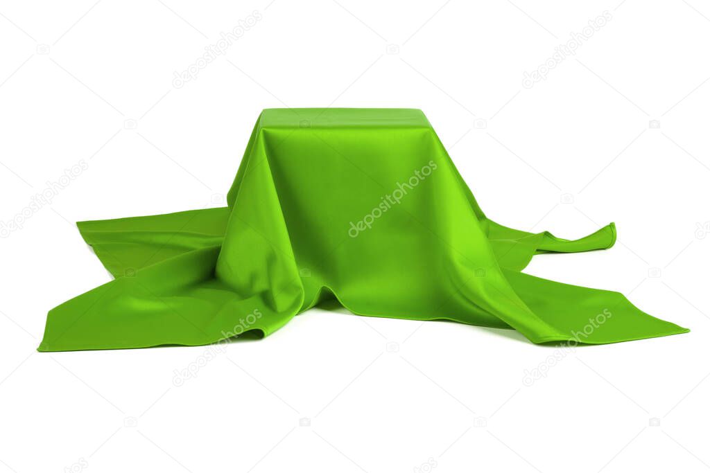 Subject covered with green cloth on a white background