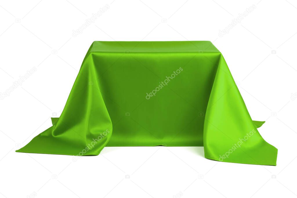 Something covered with green cloth on a white background