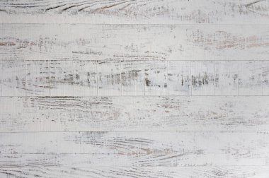 Beyaz alçıyla boyanmış birkaç kaba tahtadan oluşan arkaplan