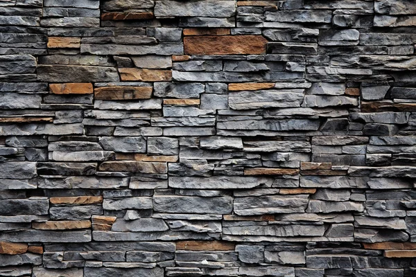 Кирпичная стена из камня — стоковое фото