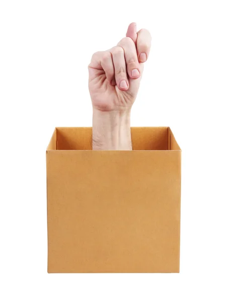 Human hand sticking out of a box — Stock Photo, Image