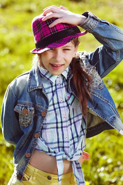 Happy girl in a jacket and hat — Stock Photo, Image