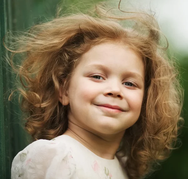 Happy beautiful cheerful curly little girl — Stock Photo, Image