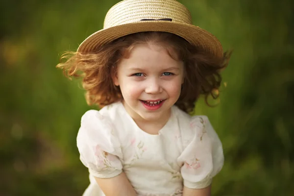 Happy cheerful girl in a hat — Stockfoto