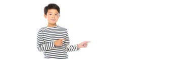Asian child pointing with fingers away isolated on white, banner  clipart