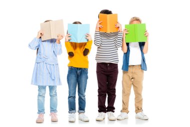 Kids holding colorful books near faces on white background clipart