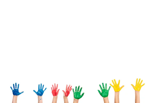 Stock image Cropped view of hands of kids in colorful paint isolated on white