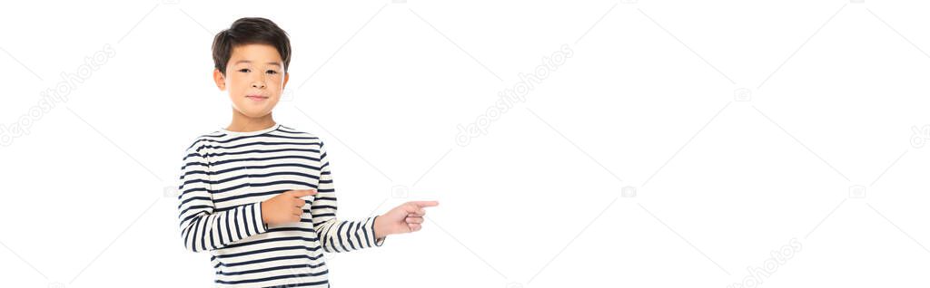 Asian child pointing with fingers away isolated on white, banner 