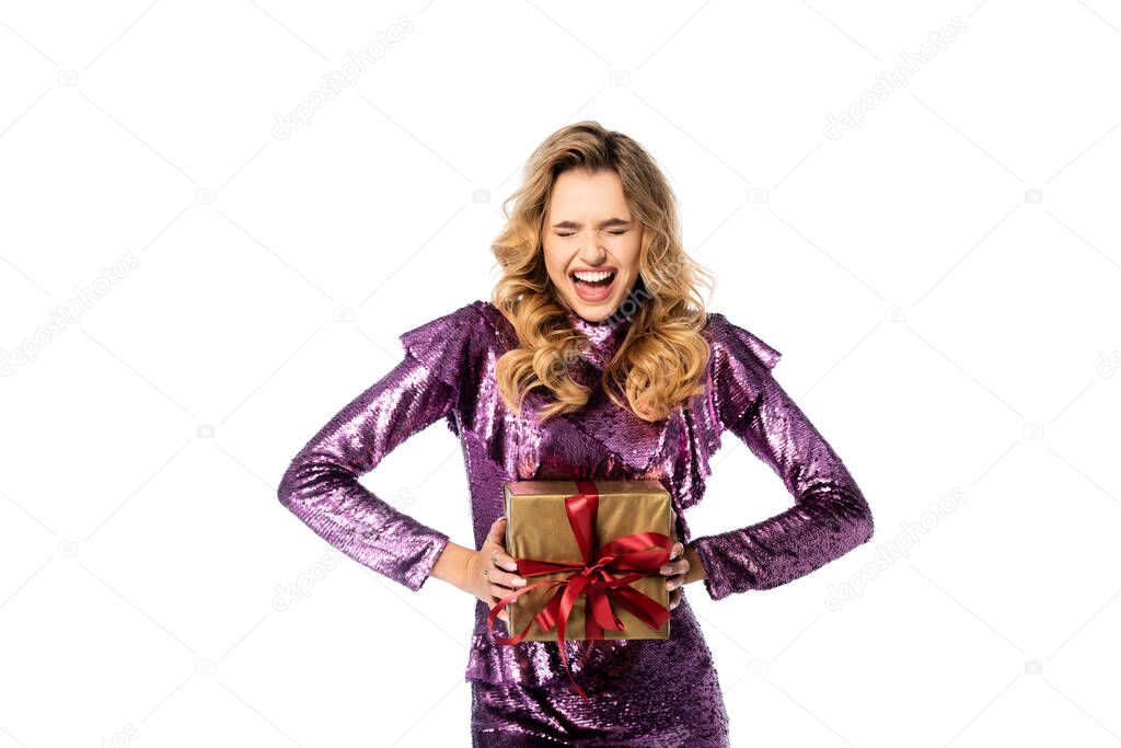 happy elegant woman in sequin dress with gift box isolated on white