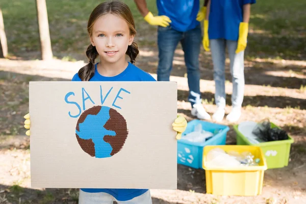 Girl Holding Placard Globe Inscription Parents Rubbish Containers Blurred Background — Stock Photo, Image