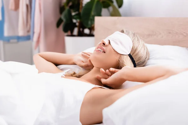 Smiling Woman White Blindfold Lying Bed Blurred Foreground — Stock Photo, Image