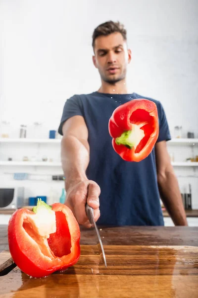 Halves Fresh Bell Pepper Wet Cutting Board Man Knife Blurred — Stock fotografie