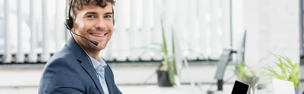 Smiling Call Center Operator Headset Looking Camera Blurred Plants Background — Stock Photo, Image