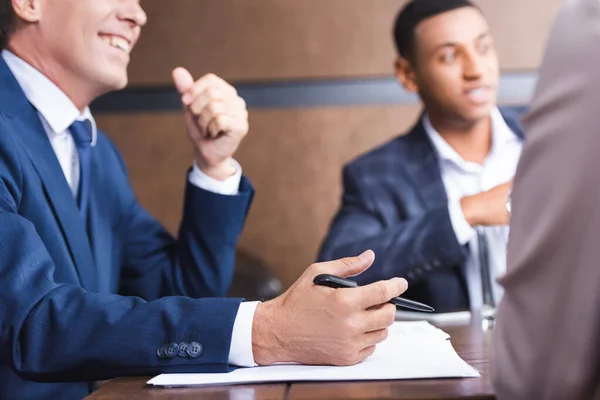 Investor Pen Papers Sitting African American Businessman Workplace Blurred Foreground — Stock Photo, Image