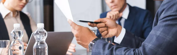 Cropped View African American Businessman Pointing Pen Paper Blurred Colleagues — Stock Photo, Image