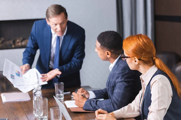 Multicultural Colleagues Sitting Workplace Blurred Angry Executive Background Meeting Room — Stock Photo, Image