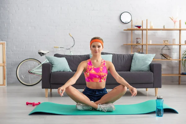 Full Length Young Sportswoman Looking Camera While Sitting Lotus Pose — Stock Photo, Image