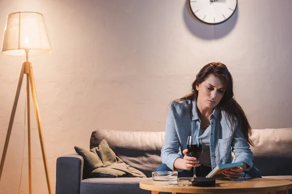 Upset Alcohol Addicted Woman Looking Photo Frame While Holding Glass — Stock Photo, Image