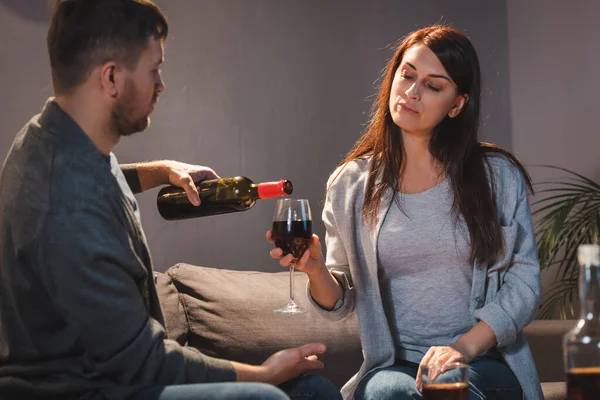 Man Pouring Red Wine Glass Wife Home — Stock Photo, Image