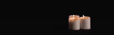 burning candles on black background, funeral concept, banner clipart