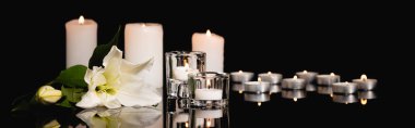 lily, candles on black background, funeral concept, banner clipart