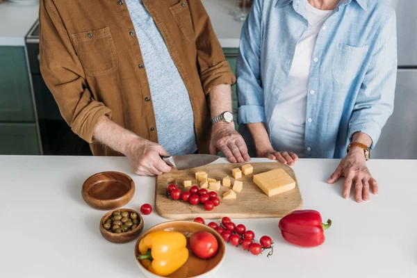 Cropped View Elderly Couple Chopping Board Vegetables Cheese Kitchen — Stock Photo, Image