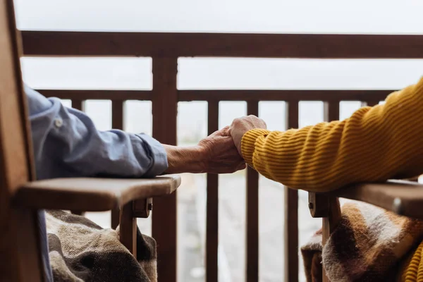 Cropped View Elderly Couple Holding Hands Terrace Blurred Background — Stock Photo, Image