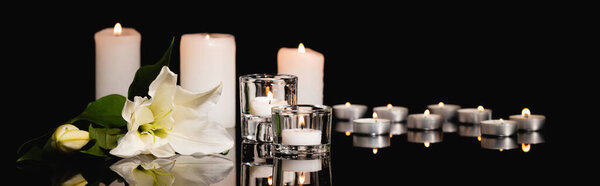 lily, candles on black background, funeral concept, banner