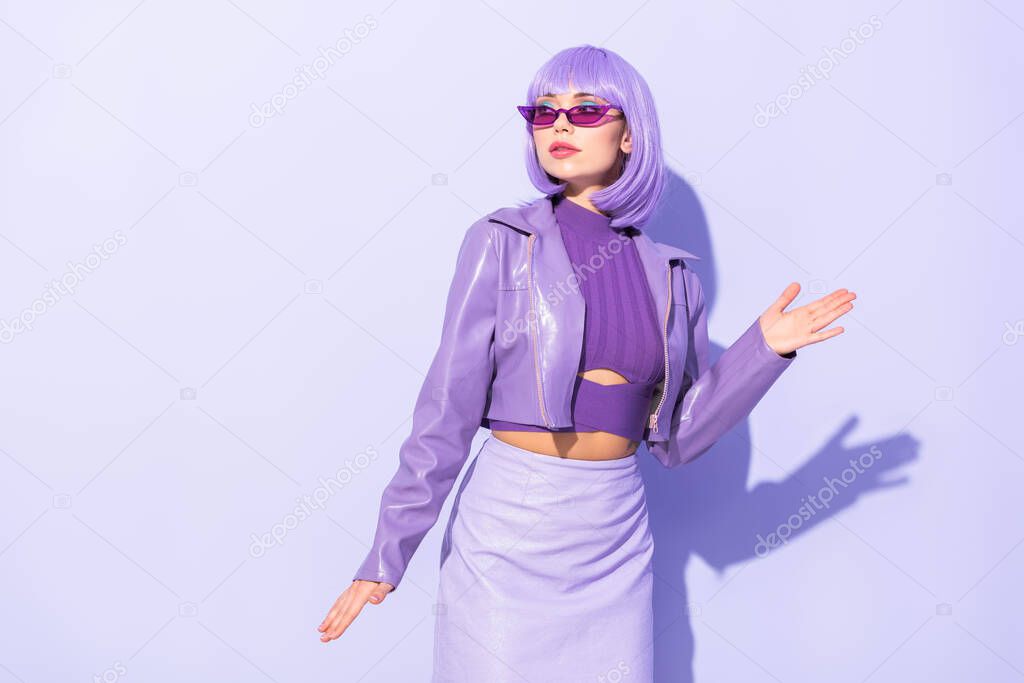 young woman dressed in doll style on violet colorful background