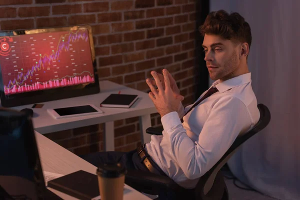 Businessman Sitting Computers Charts Coffee Blurred Foreground Evening — Stock Photo, Image