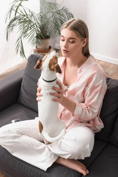 Young Woman Cuddling Jack Russell Terrier Living Room — Stock Photo, Image