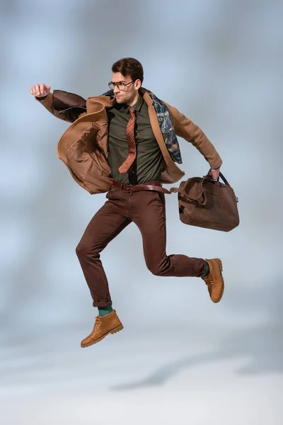 Stylish Man Winter Coat Holding Leather Briefcase While Jumping Grey — Stock Photo, Image
