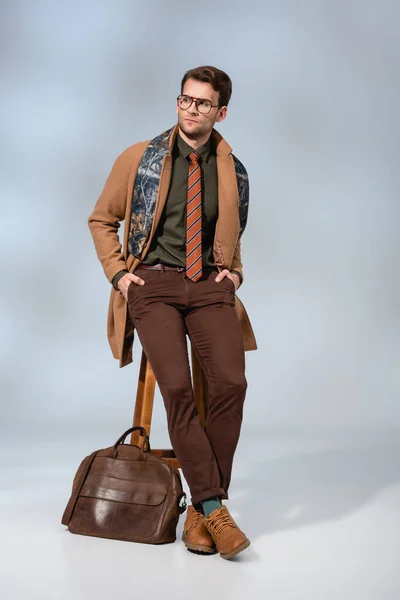 Full Length Stylish Man Winter Coat Glasses Sitting Wooden Chair — Φωτογραφία Αρχείου