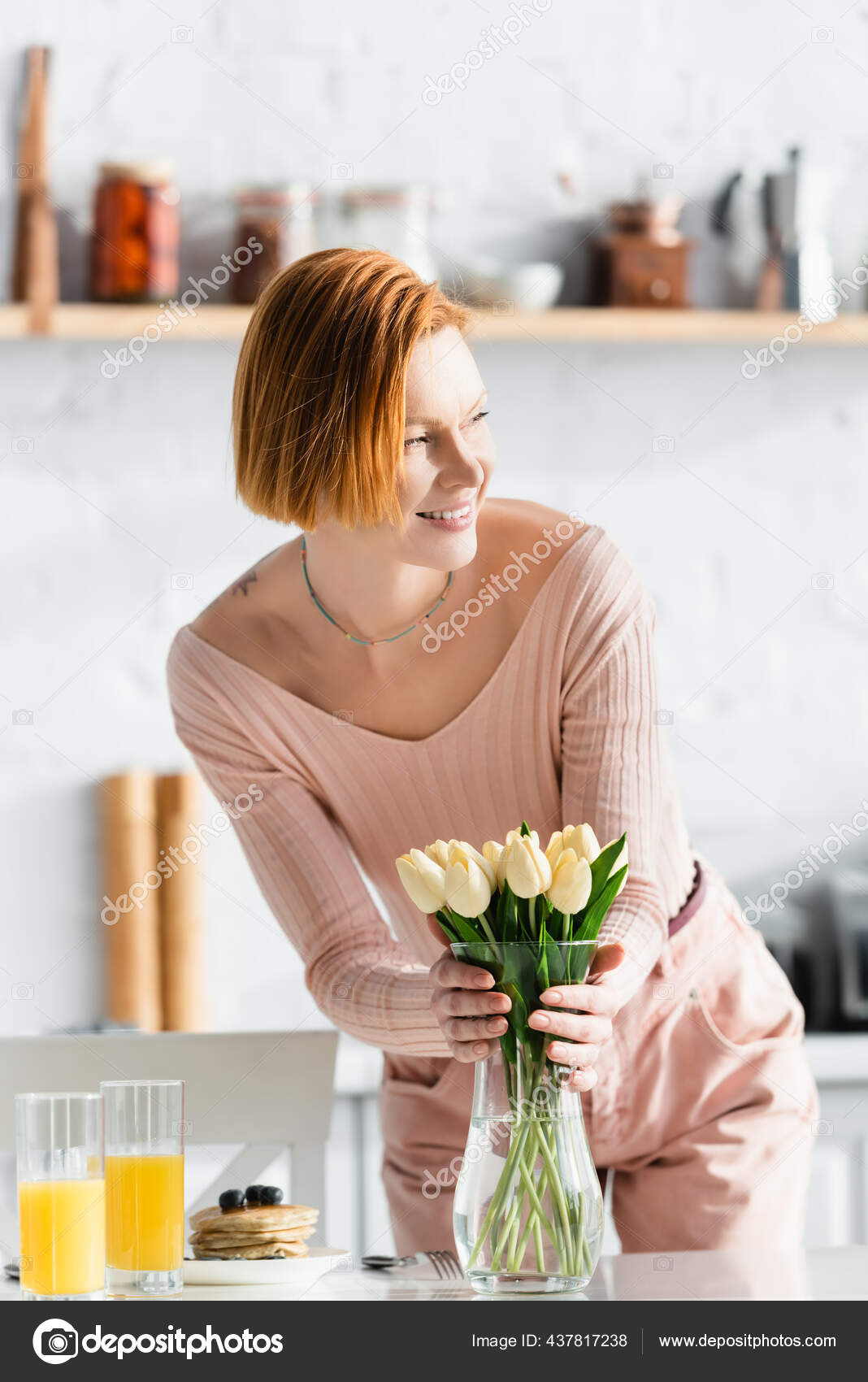 Happy Redhead Woman Putting Tulips Vase Orange Juice Pancakes Table Stock  Photo by ©AndrewLozovyi 437817238