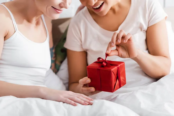 Cropped View Excited Lesbian Woman Opening Gift Box Girlfriend Bed — Stock Photo, Image