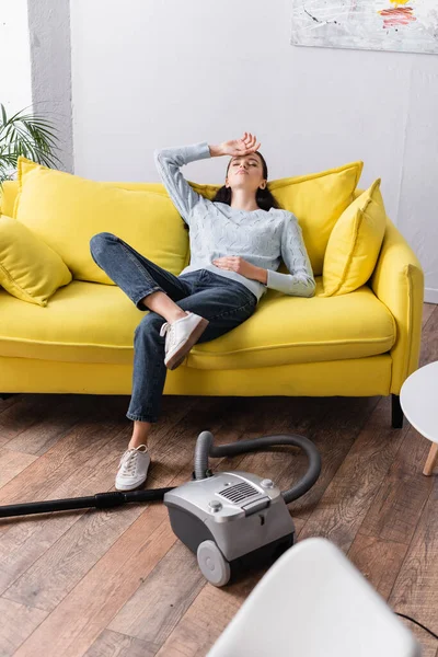 Exhausted Housewife Sitting Sofa Closed Eyes Vacuum Cleaner — Stock Photo, Image