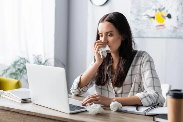 Allergic Woman Wiping Nose Paper Napkin While Working Laptop Blurred — Stock Photo, Image