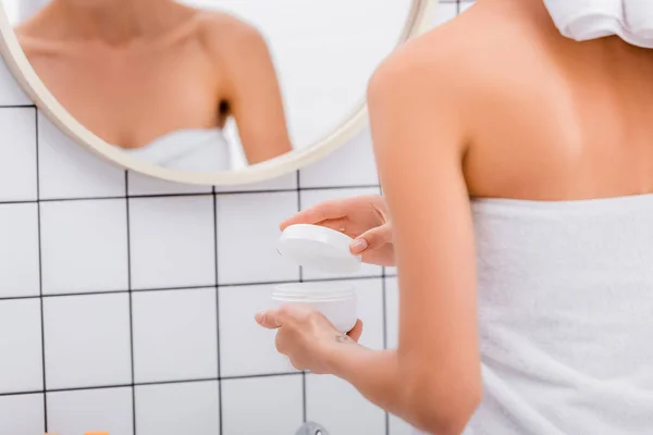 Cropped View Woman Opening Cosmetic Cream Blurred Reflection Mirror — Stock Photo, Image