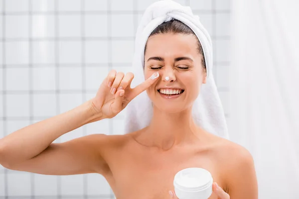 Cheerful Woman Closed Eyes Applying Face Cream Nose Bathroom — Stock Photo, Image